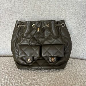 CHANEL Quilted Olive Green Drawstring Backpack with Front Pockets